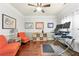 Inviting home office with hardwood floors, warm lighting, and comfortable seating at 3599 Bellmonte Dr, Atlanta, GA 30337