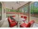 Inviting covered patio featuring a dining table, comfortable seating, ceiling fans, and a relaxing atmosphere at 3599 Bellmonte Dr, Atlanta, GA 30337