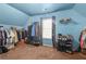 Walk-in closet with ample storage including shelves, hanging rods, and shoe racks at 3599 Bellmonte Dr, Atlanta, GA 30337