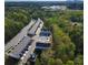 Aerial view featuring well-maintained townhomes, landscaping, and convenient parking at 518 Scenic Pass, Woodstock, GA 30189
