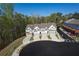Aerial view of new townhomes with modern exteriors, driveways, and street access at 518 Scenic Pass, Woodstock, GA 30189