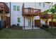 Multi-level back deck with fenced yard and walkout basement access at 518 Scenic Pass, Woodstock, GA 30189