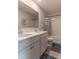 Bathroom features double vanity, framed mirror, and a tub with shower at 518 Scenic Pass, Woodstock, GA 30189