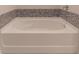 Bathtub with decorative tile backsplash at 518 Scenic Pass, Woodstock, GA 30189