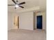 Bedroom features neutral carpet, a window with blinds, and a ceiling fan at 518 Scenic Pass, Woodstock, GA 30189