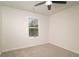 Bedroom features carpet, a window with blinds, and a ceiling fan at 518 Scenic Pass, Woodstock, GA 30189