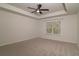 Bedroom features neutral carpet, a window with blinds, and a ceiling fan at 518 Scenic Pass, Woodstock, GA 30189