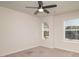 Bright bedroom with neutral carpet, ceiling fan and windows for great natural light at 518 Scenic Pass, Woodstock, GA 30189