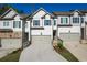 Charming townhome with neutral paint, driveway, and attached garages in a desirable neighborhood at 518 Scenic Pass, Woodstock, GA 30189