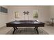 Well-lit game room showcasing a pool table with cue rack and overhead lighting at 518 Scenic Pass, Woodstock, GA 30189
