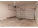 Empty garage with concrete floor and white insulated garage door at 518 Scenic Pass, Woodstock, GA 30189