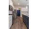 Stylish kitchen featuring stainless steel appliances, a large island, and modern accents at 518 Scenic Pass, Woodstock, GA 30189