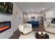 Cozy living room with modern fireplace open to the kitchen at 518 Scenic Pass, Woodstock, GA 30189