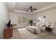 Spacious main bedroom with tray ceiling, ceiling fan, and neutral decor at 518 Scenic Pass, Woodstock, GA 30189