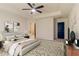 Spacious main bedroom with a ceiling fan, carpet, and ensuite bathroom at 518 Scenic Pass, Woodstock, GA 30189