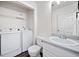 Bathroom featuring a washer and dryer for a complete laundry and bathing solution at 6703 Gallant Se Ct, Mableton, GA 30126