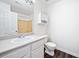 Bright bathroom featuring a large mirror, vanity with sink, and tub with shower at 6703 Gallant Se Ct, Mableton, GA 30126