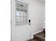 Clean and bright entryway with a white door and wood flooring at 6703 Gallant Se Ct, Mableton, GA 30126