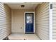 Inviting front entrance features a blue door and neutral siding at 6703 Gallant Se Ct, Mableton, GA 30126