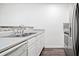Clean kitchen features stainless steel appliances, laminate countertops and flooring at 6703 Gallant Se Ct, Mableton, GA 30126