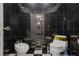 This tiled bathroom features black and white checkered flooring and unique fixtures at 725 Links View Dr, Sugar Hill, GA 30518