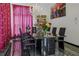 Chic dining room with black marble floors, modern table, and chandelier at 725 Links View Dr, Sugar Hill, GA 30518