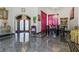 Elegant dining room with marble floors, stylish lighting, and decor at 725 Links View Dr, Sugar Hill, GA 30518