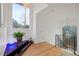 Bright hallway features a hanging chandelier, black railing, and potted plant at 725 Links View Dr, Sugar Hill, GA 30518