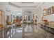 Spacious living room with marble floors, large windows, and elegant furnishings at 725 Links View Dr, Sugar Hill, GA 30518