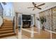 Bright living room boasting hardwood floors, large windows, and stylish accents at 725 Links View Dr, Sugar Hill, GA 30518