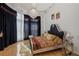 Features a luxurious bed and natural light from the large window at 725 Links View Dr, Sugar Hill, GA 30518