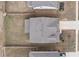 Aerial view of a well-maintained home with a dark roof, a tidy yard, and a driveway at 1840 Wellston Dr, Lawrenceville, GA 30043