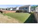 Expansive backyard with lush green grass, a wooden fence, and a covered patio perfect for outdoor living at 1840 Wellston Dr, Lawrenceville, GA 30043