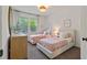 Charming bedroom with twin beds, natural light, and stylish decor creating a cozy, inviting space at 1840 Wellston Dr, Lawrenceville, GA 30043