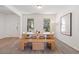 Bright dining room features a wooden table, bench seating, and a modern light fixture, perfect for Gathering gatherings at 1840 Wellston Dr, Lawrenceville, GA 30043