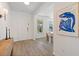 Bright entryway featuring wood-look floors, a modern art print, and decorative table at 1840 Wellston Dr, Lawrenceville, GA 30043