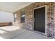 Close-up of the front entrance with a dark-colored door and brick surround at 1840 Wellston Dr, Lawrenceville, GA 30043