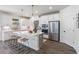 Bright kitchen with stainless steel appliances, large center island with seating, and gray tile backsplash at 1840 Wellston Dr, Lawrenceville, GA 30043
