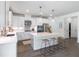 Modern kitchen featuring stainless steel appliances, white cabinets, and a large center island with seating at 1840 Wellston Dr, Lawrenceville, GA 30043