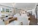 Bright, open living space includes modern decor, a large sofa, and a peek into the well-equipped kitchen at 1840 Wellston Dr, Lawrenceville, GA 30043