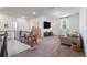 Cozy loft area with plush carpet, comfortable seating, and plenty of natural light at 1840 Wellston Dr, Lawrenceville, GA 30043