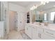 Elegant primary bathroom with dual vanities, a glass-enclosed shower, and a spacious layout, perfect for relaxation at 1840 Wellston Dr, Lawrenceville, GA 30043