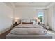 Serene primary bedroom featuring a king-size bed, soft lighting, and neutral tones creating a relaxing retreat at 1840 Wellston Dr, Lawrenceville, GA 30043