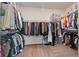 Spacious walk-in closet with ample shelving and hanging space for organized storage of clothing and accessories at 1840 Wellston Dr, Lawrenceville, GA 30043