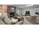 Finished basement living area featuring a brick fireplace and comfortable neutral furniture at 2000 Old Dominion Rd, Atlanta, GA 30350