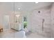 Elegant bathroom with marble tiles, a glass-enclosed shower, and a double vanity at 2000 Old Dominion Rd, Atlanta, GA 30350