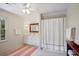 Bright bathroom with vanity, tile floors, and shower with white curtain at 2000 Old Dominion Rd, Atlanta, GA 30350