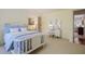 Inviting bedroom showcasing light blue bedding, a vanity, and a view into an adjacent seating area at 2000 Old Dominion Rd, Atlanta, GA 30350