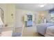 Well-lit bedroom with yellow walls, complemented by blue accents on furniture and bedding at 2000 Old Dominion Rd, Atlanta, GA 30350
