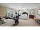 Finished basement bedroom with two beds, carpet, and white paneled walls at 2000 Old Dominion Rd, Atlanta, GA 30350